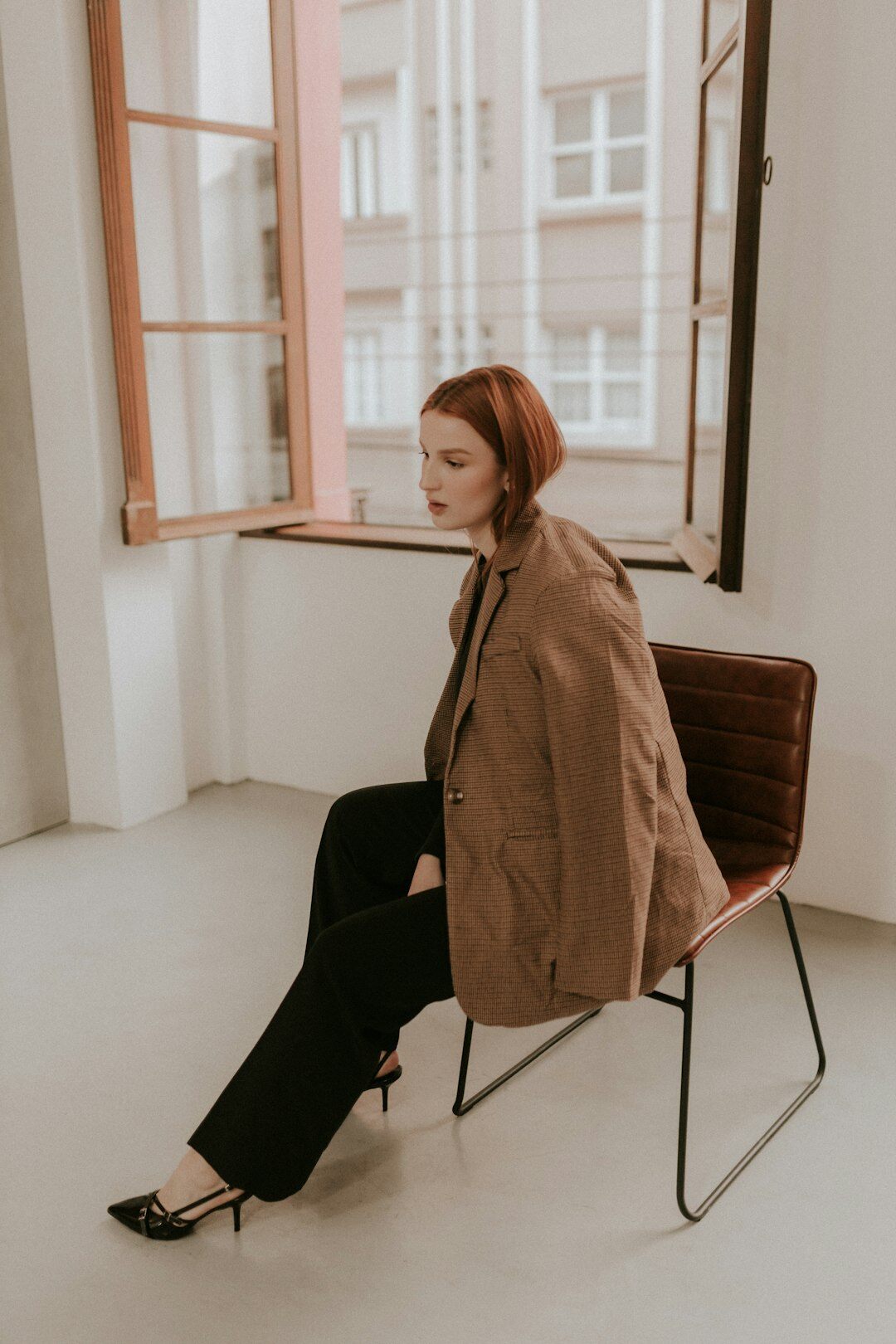 Portrait of a German woman psychologist in a tailored blazer