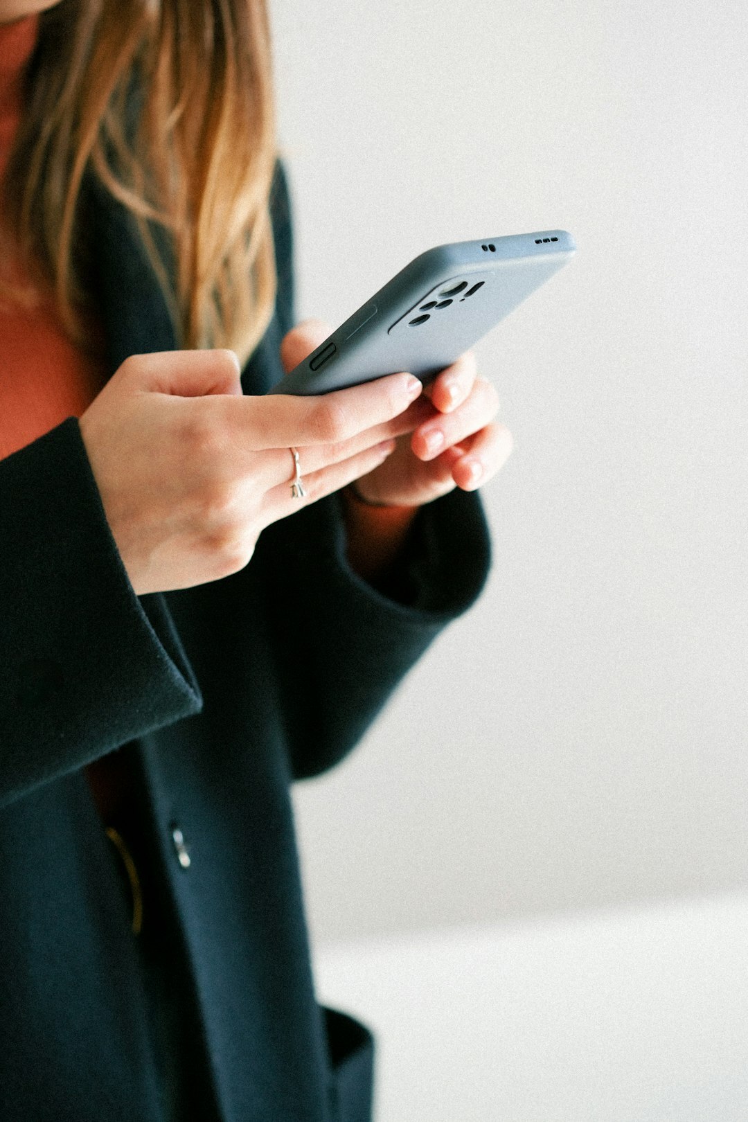 young woman scrolling phone